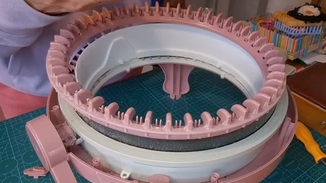 How to Clean and Lubricate Your Sentro Knitting Machine 3 Disassembled Sentro machine showing lint around the pink needle ring during a deep clean